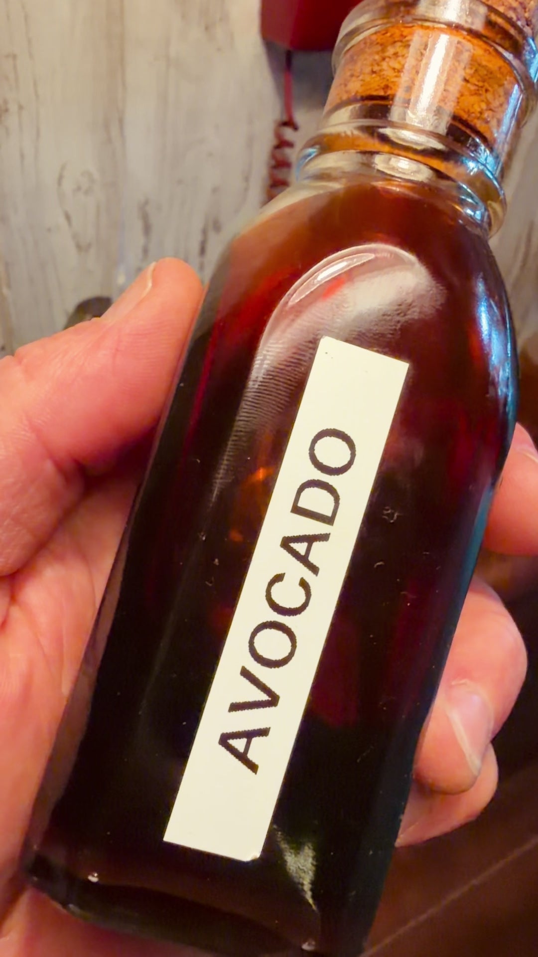 Jar of Avocado Blossom honey in the light in the tasting room